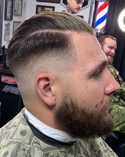 Fancy Pompadour Haircut with Shaved Sides and Full Beard