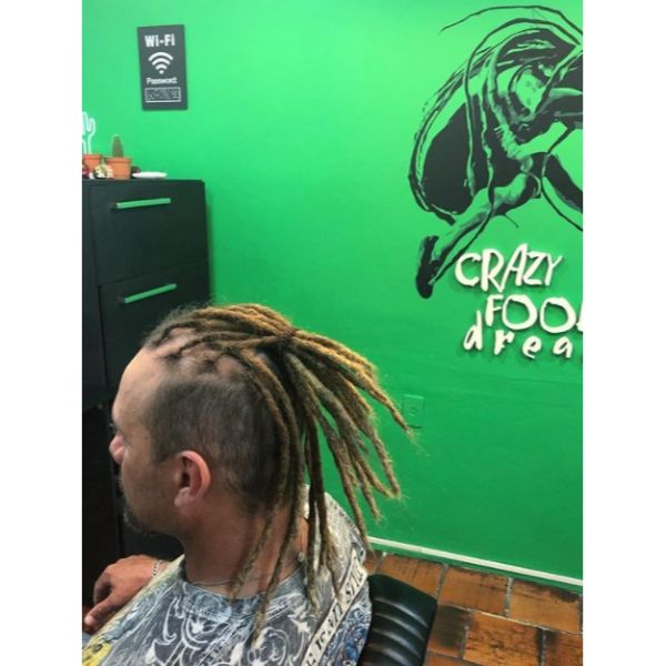 a man with High Fade with Thin dreads