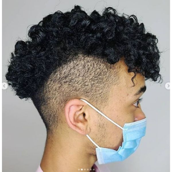  High Fade with Curly Mohawk curly hairstyles for men