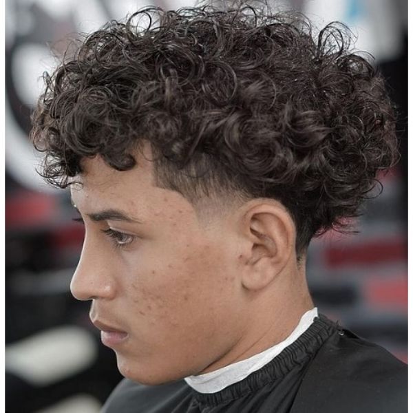 Taper Fade with Curly Top Hairstyle For Men
