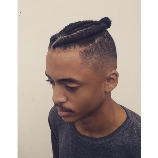  High Fade With Box Braids And Top Knot