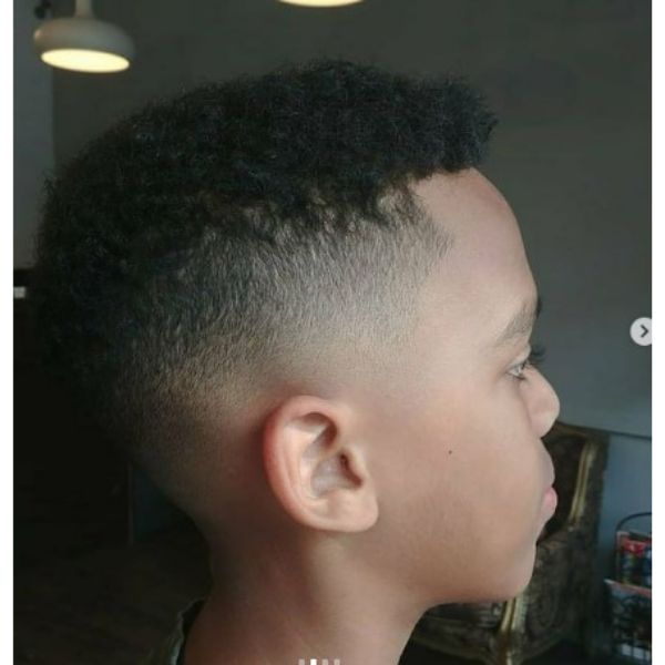 Skin High Fade With Textured Curly Top Afro Hairstyle