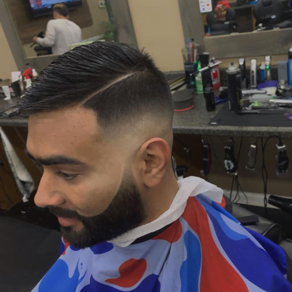 A man wearing haircut cover