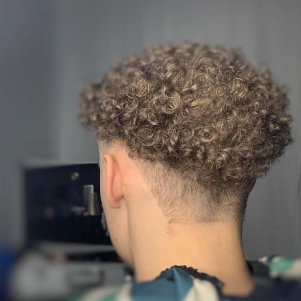 Man with Mid Fade Curly Hair