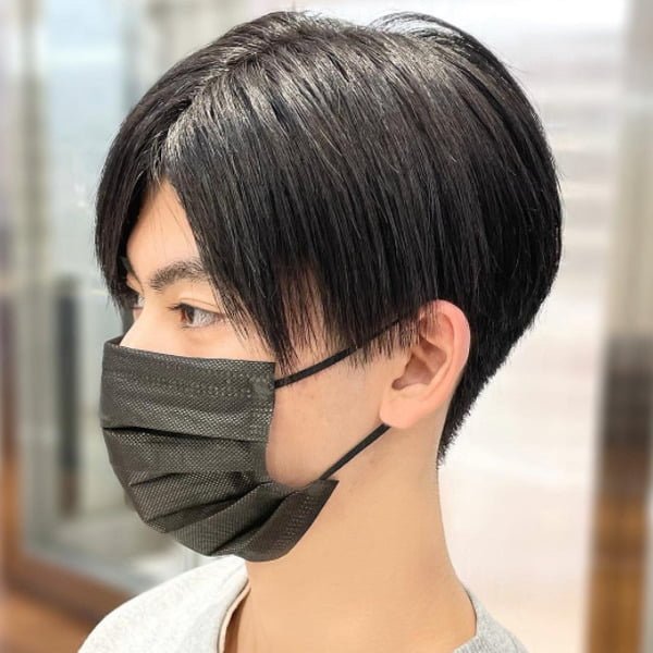 Young boy wearing mask had his hair styled into Black Eboy Hairstyle