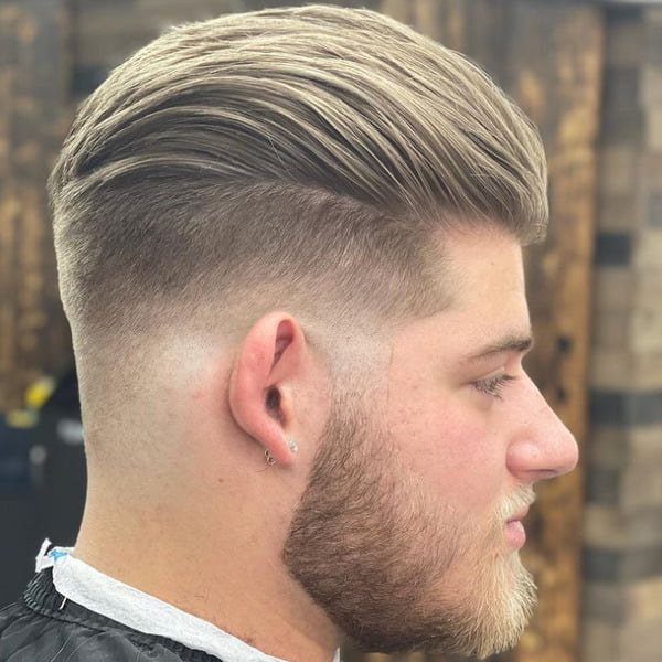 Guy with earrings had his hair styled into Bryce Harper Drop Fade Haircut
