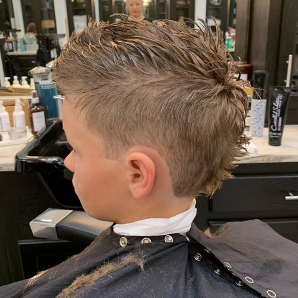 Faded Mohawk with Bryce Harper Style - Young boy wearing barber's cape 