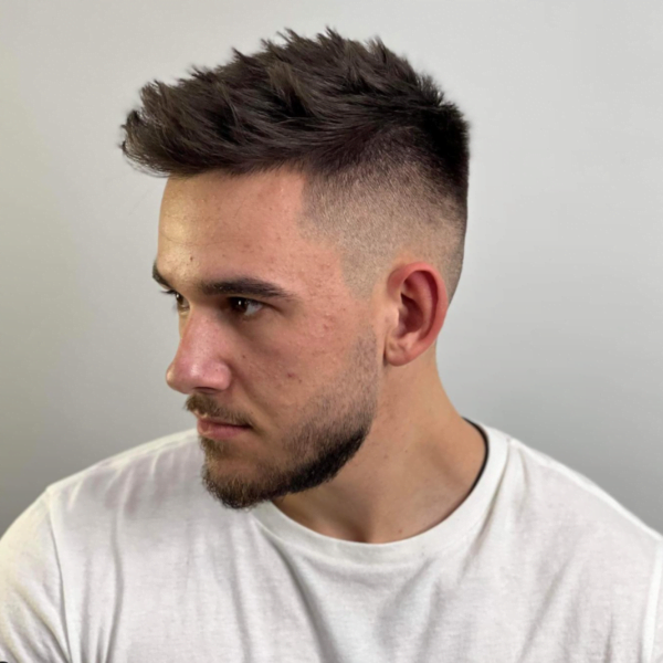 Man wearing white shirt with his Spiky Temple Fade Haircut